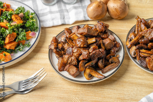 Принти на полотні Marinated steak tips with mushrooms. Beef dinner dish