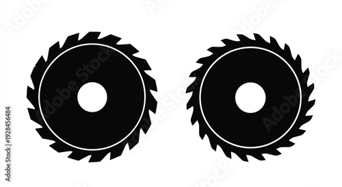Two circular saw blades shown in a stark black silhouette
