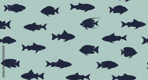Dark blue fish silhouettes swim on light blue background creating a mesmerizing aquatic pattern