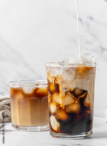 Photography Iced coffee with oat milk creamer swirl