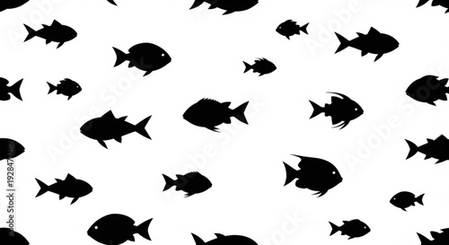 Black silhouettes of various fish species scattered on a white background creating a striking visual pattern with different shapes and sizes