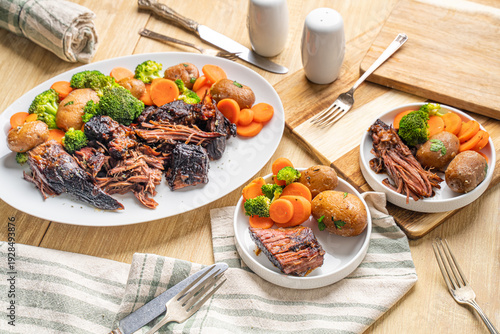 Obraz na plátně Hearty Midwestern food. Beef pot roast with carrots and potatoes