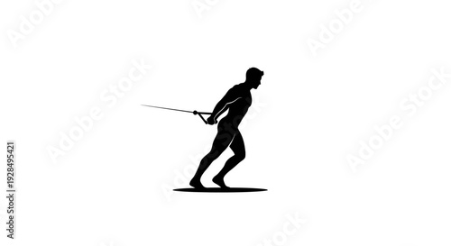 Silhouette of a man skiing downhill in motion
