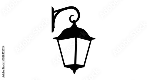 A black silhouette of an ornate vintage outdoor wall mounted lantern