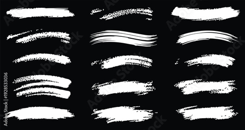 Collection of white brush strokes on black background for artistic and design purposes