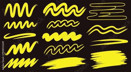 Collection of yellow squiggly lines and brush strokes on black background