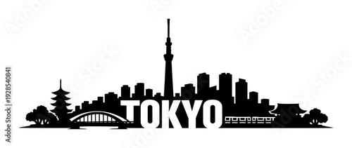 Illuminated tokyo letters with silhouetted skyline and bridge