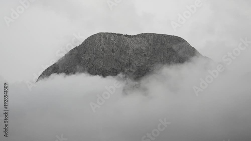 Peaceful mountain peak above clouds, Spain. Calm time lapse view of mesa pinnacle, serene beautiful clouds.