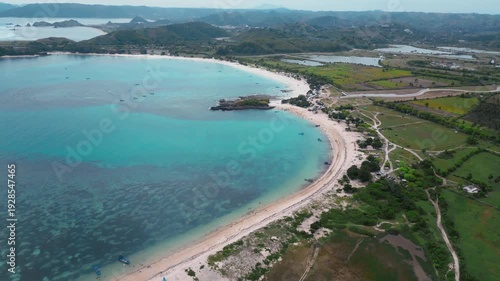 Wallpaper Mural Calm Coast From Above. Vivid High Altitude Picture Of Tranquil Seaside And Hilly Terrain. Aerial Drone Shot Showcasing Serene Turquoise Coastlines Surrounded By Rich Green Hills, Lombok,Vertical video Torontodigital.ca