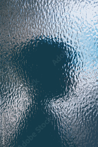 Child silhouette behind textured glass for children psychology, neurodivergence, autism, sensory sensitivity, privacy, emotional vulnerability, identity, introspection and childhood development themes