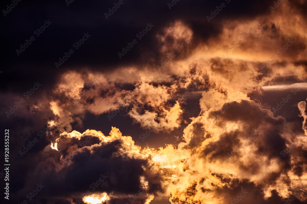 Fototapeta premium Dramatic Golden Sunset Sky with Dark Clouds