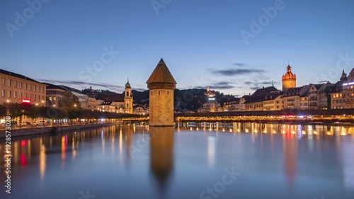 Day to night long exposure time lapse panorama Lucerne old town and Chapel bridge, Switzerland.