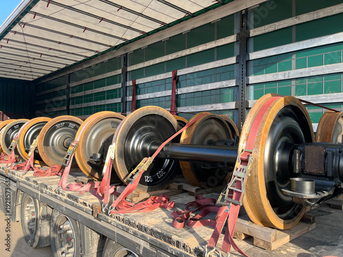 Transportation of Railway Wheelsets in a Semi-Trailer Truck — Steel Axles Delivery on Flatbed Trailer