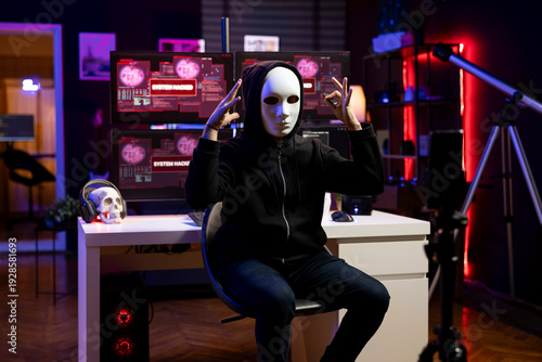 Tableau sur toile Hacker claiming involvement in global government hack filming video in underground lair