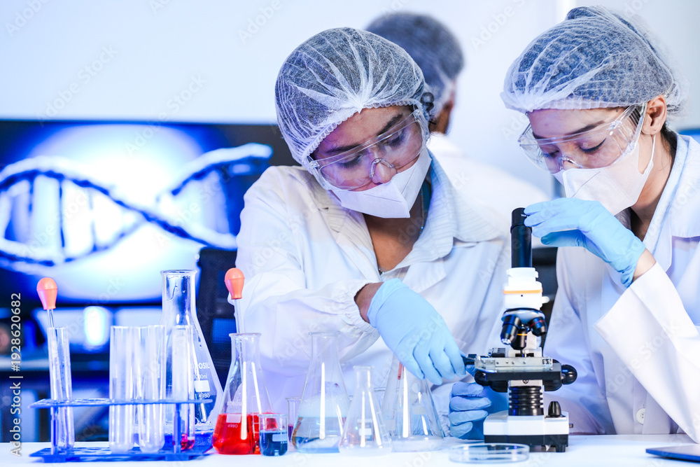 Fototapeta premium Genomic researchers analyzing molecular dna structures via microscopy. Female scientists collaborating on genetic sequencing protocols in advanced biotechnology laboratory.