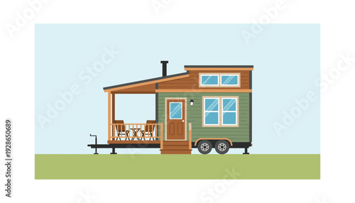 Cozy green tiny house on wheels with wooden porch and deck