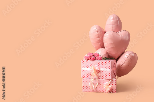 Heart-shaped balloons with gift boxes and rose flowers on beige background. Valentine's Day celebration