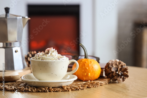 Cup of pumpkin latte on tab...