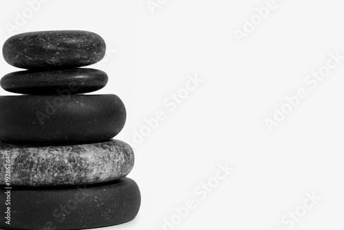 Stack of pebbles on light b...