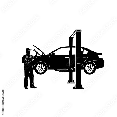 Mechanic working on car lifted on hydraulic platform in auto repair shop
