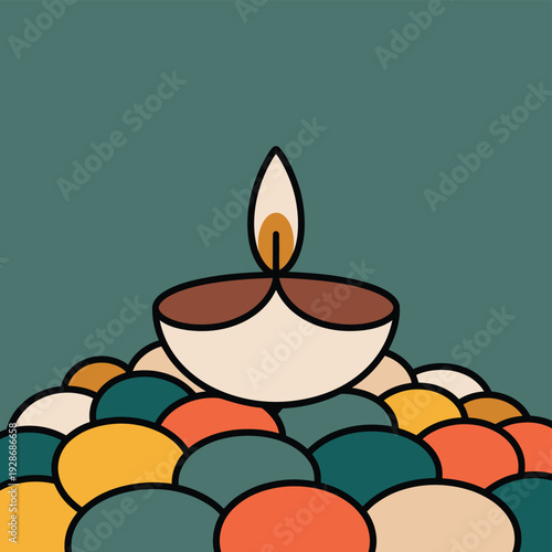 A traditional oil lamp burns brightly atop a pile of colorful decorative stones.