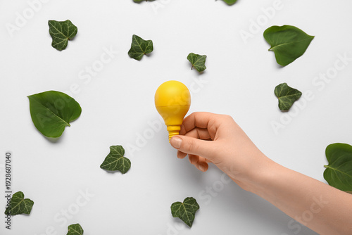 Female hand with light bulb...