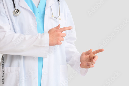Male doctor pointing at som...