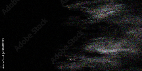 Abstract dark blue space texture featuring a black hole in the snow and wall under a stormy night sky with smoke and moon light backdrop