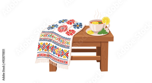 A wooden stool with an intricately embroidered towel draped over it, holds a steaming cup of lemon tea and mint leaves against a white background.