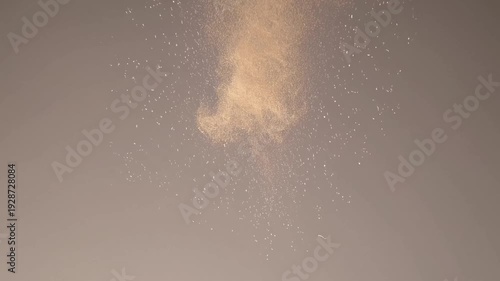 Abstract smoke pattern ascending in soft brown tones on gray background  