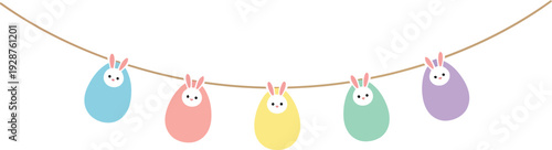 Colorful Easter bunny eggs hanging on a string for spring celebration