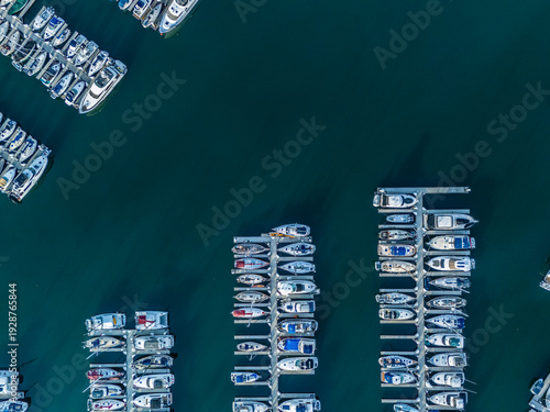 Top down aerial view of Long Beach marina with aligned yacht docks and luxury boats, coastal real estate and investment concept in Southern California