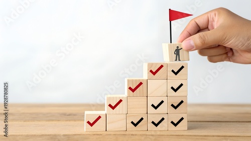Hand Placing Wooden Block with Person and Red Flag on Staircase of Checkmarked Blocks – Strategy, Abstract, Conceptual, Business, Productivity, Goal Achievement, Success, Professional Development