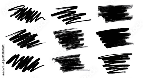 Collection of nine black marker scribbles and brush strokes on a white background.