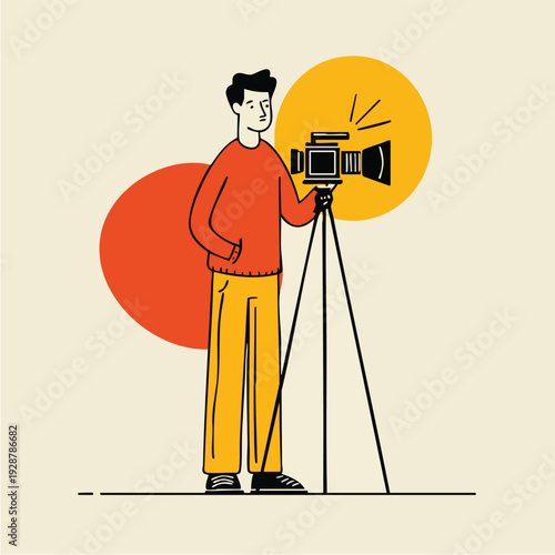 Male Photographer with Video Camera on Tripod.