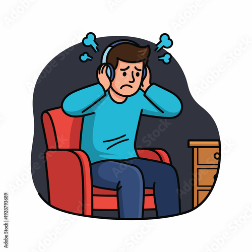 A man sitting on a red chair wearing headphones