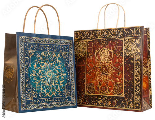 Ornate patterned gift bags with handles, one teal, one red