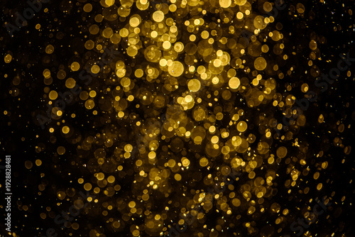 Blurred photo with golden dots visible glittering, shining brightly look and feel luxurious