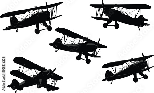 Black silhouettes of five vintage biplanes flying airplanes vintage planes aircraft