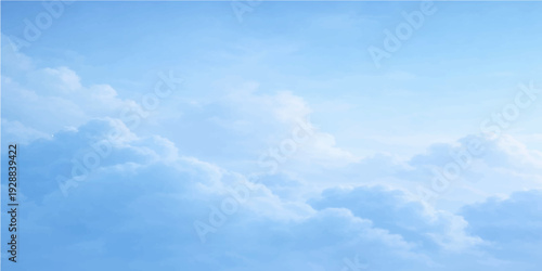 Fluffy white clouds float through a beautiful clear blue sky on a bright sunny summer day in this high atmosphere nature cloudscape