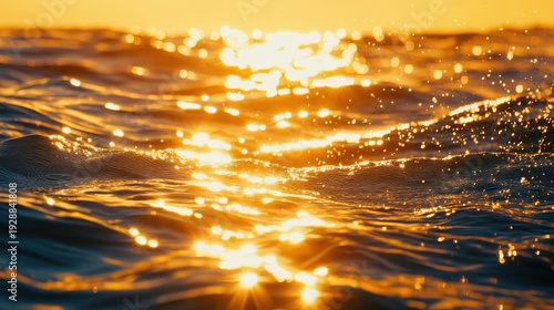 Golden hour sun reflecting on ocean waves creating a vibrant luminous spectacle during sunrise or sunset