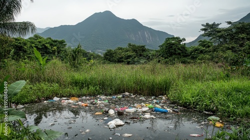 Polluted lake surface with accumulated garbage after heavy rain, mountains in background, wide angle
