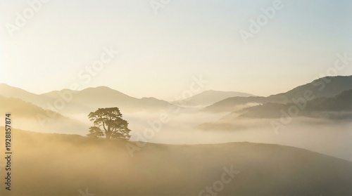 A serene sunrise over foggy mountain valleys, soft golden light.