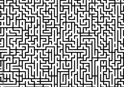 A complex black and white maze pattern viewed from directly above, showcasing intricate design and pathways.