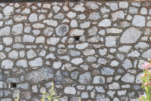 Wallpaper Mural Stone wall with irregular shaped rocks and plants growing nearby outdoor Torontodigital.ca