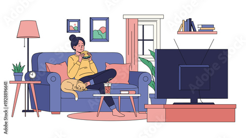 Young woman sitting on a cozy sofa with her cat and eating a hamburger while watching television in her living room.