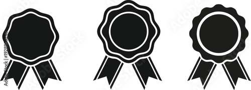 Three black and white blank ribbon badges or labels