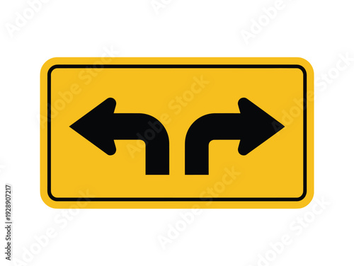 Yellow rectangular road sign with two black arrows indicating options for turning left or right.