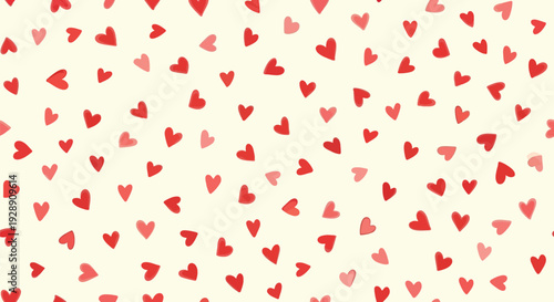 Pattern of scattered red and pink hearts on a light cream background, conveying a cheerful and romantic tone.