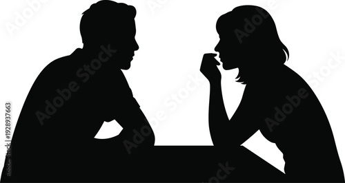 Silhouette of a man and woman sitting at a table, engaged in a thoughtful conversation, black and white